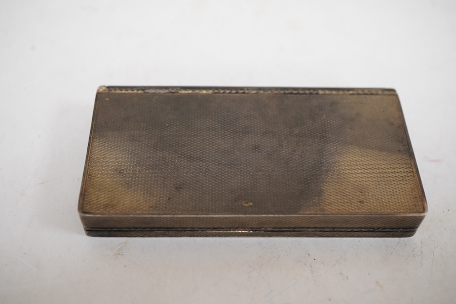 An early to mid 20th century engine turned silver and blue guilloche enamelled rectangular compact (a.f.), London import marks, 79mm.